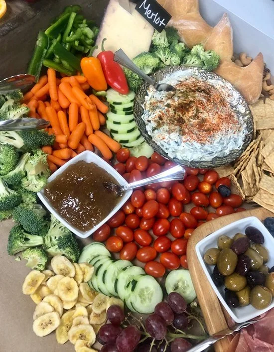 Corporate luncheon catering package featuring assorted fresh vegetables and dips