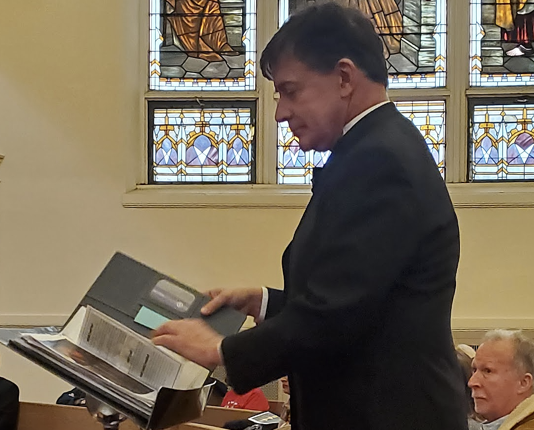 Director Paul Laprade directing the TVC Tutti Voce Collective Spring 2025 Concert