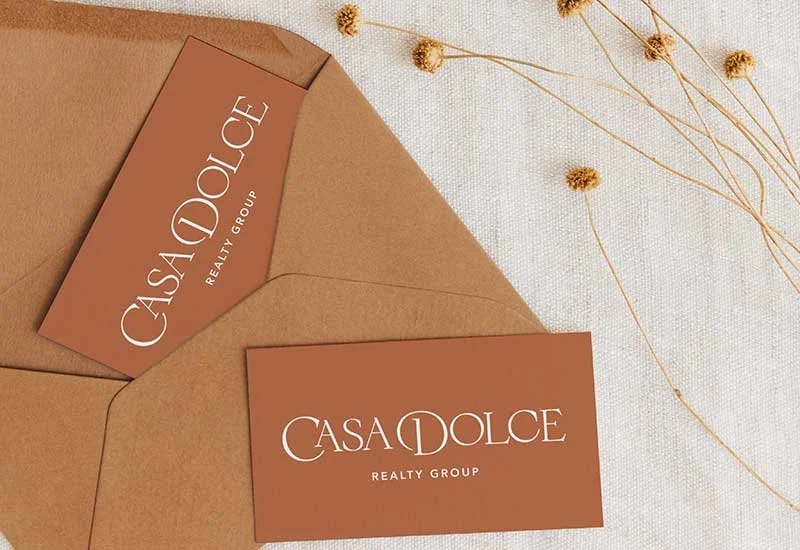 Casa Dolce Realty Group logo on terracotta cards