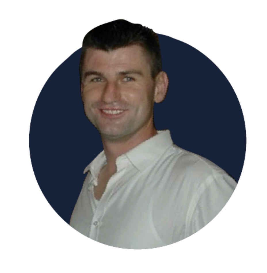 A smiling man with dark hair slicked back, wearing a white button-up shirt, in front of a dark navy circular background.