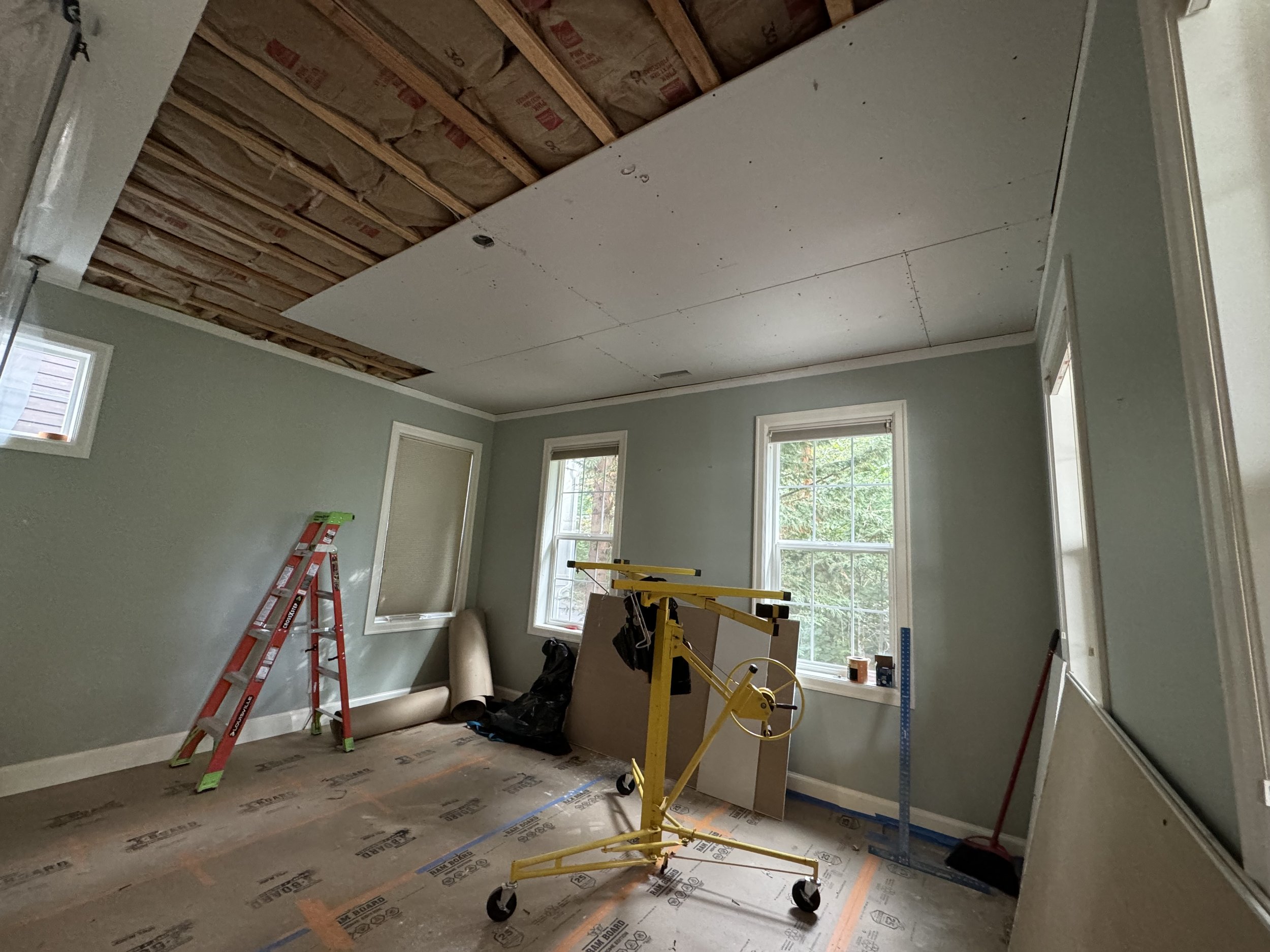 Ceiling drywall repairs after living room is water damaged.