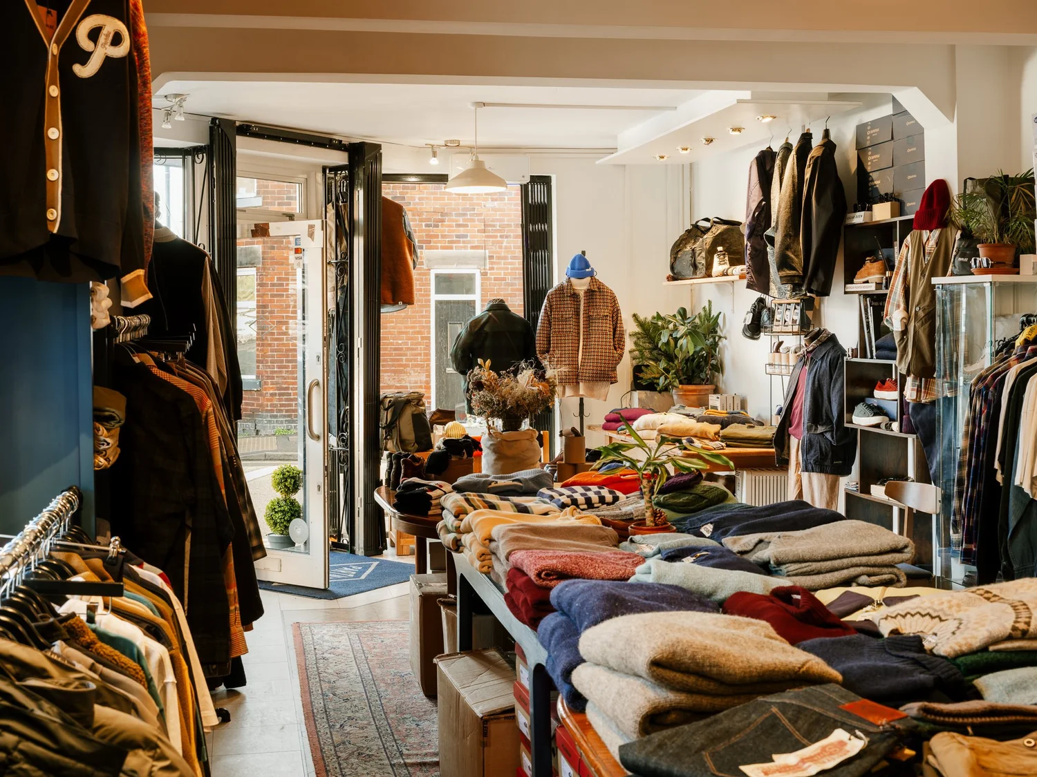 Inside the Partners shop: rails of jackets and tables of folded knitwear