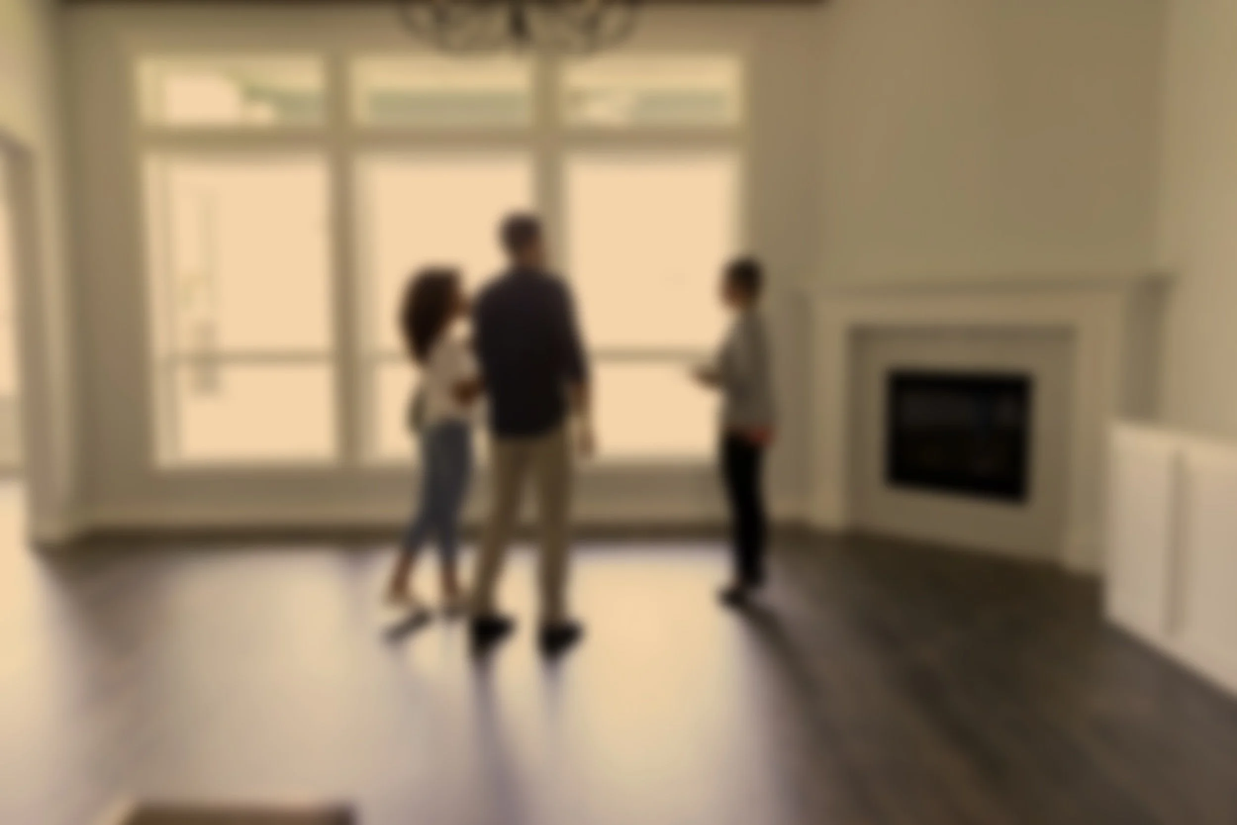A blurred photo of three people talking inside a room with large windows and a fireplace.