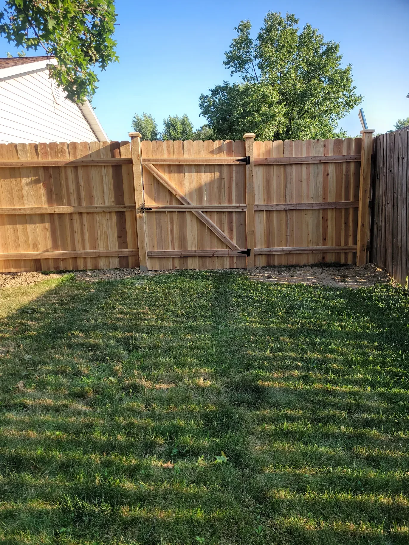 Cedar wooden privacy fence around a backyard in Cleveland, Ohio