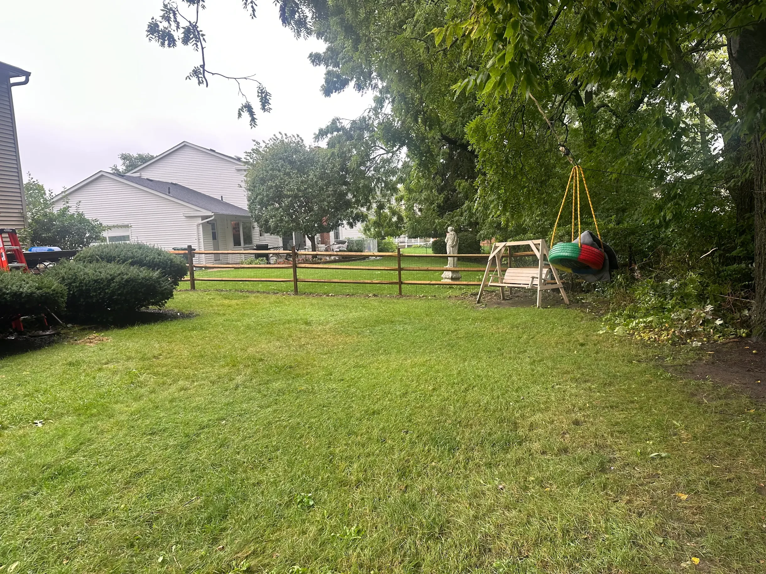 Split rail fence with galvanized mesh around backyard in Columbus, Ohio.
