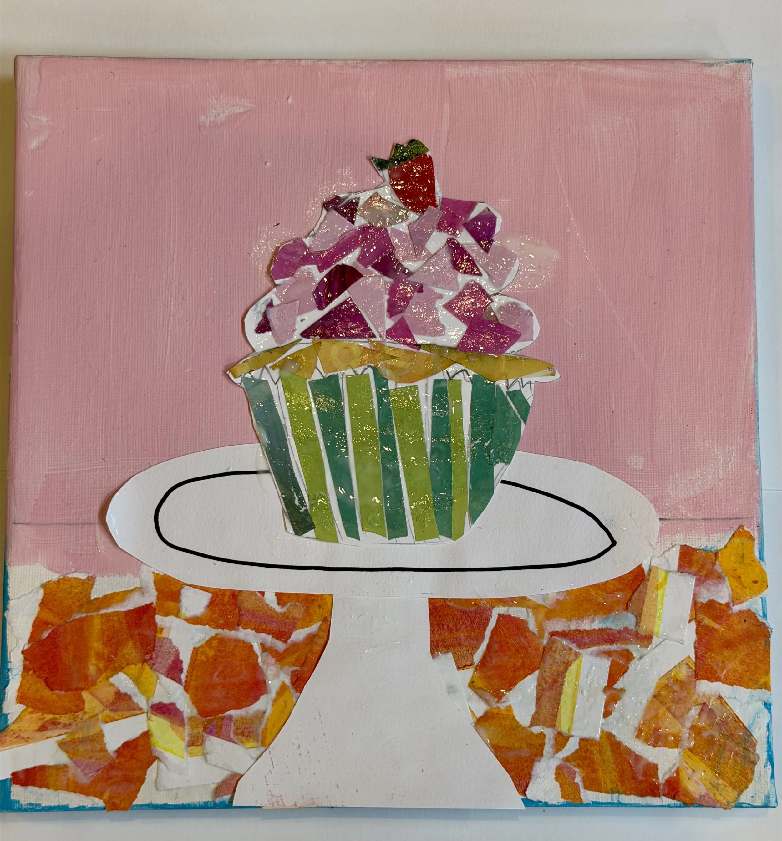 Mixed media collage artwork of a cupcake with pink frosting, placed on a white plate on a table with orange and white mosaic tiles, painted background in pink and white.