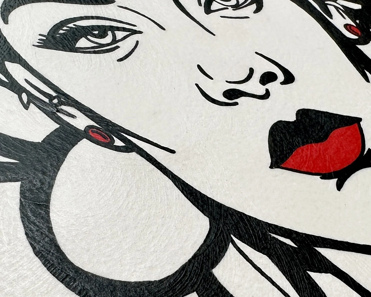 Artist Brett Hodges at Quiet Corner Art Studio, Omaha, NE, Pop Art portrait of Rihanna with bold black and white contrast and contemporary red accents.