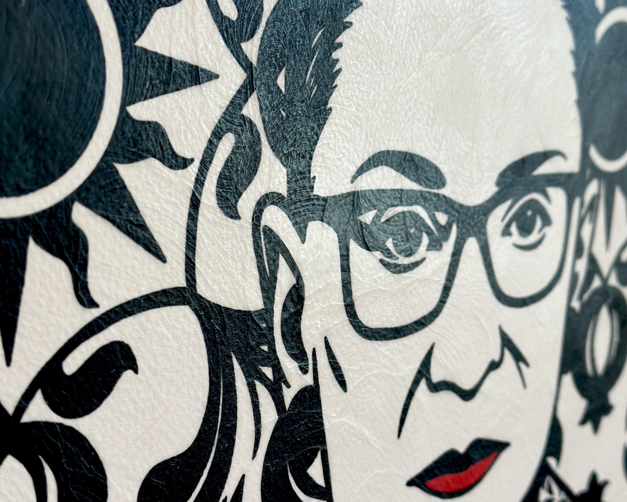 Artist Brett Hodges at Quiet Corner Art Studio, Omaha, NE, original gouache Pop Art portrait of Ruth Bader Ginsburg with bold black and white contrast and red accents.