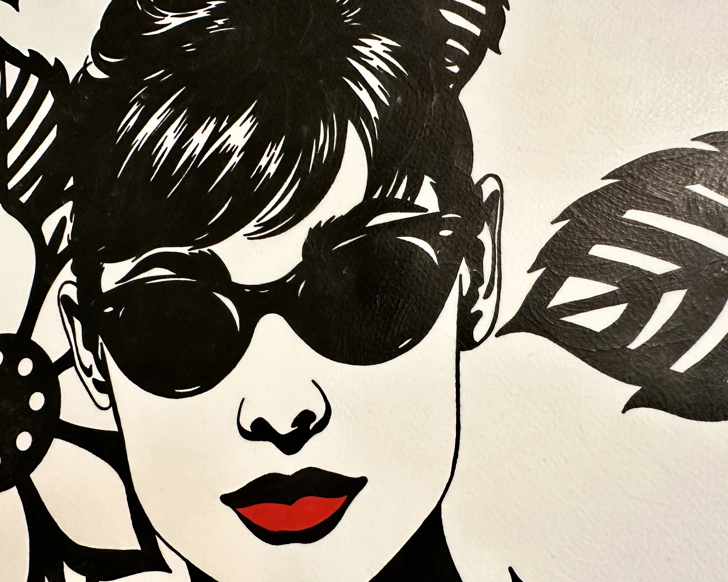 Original framed painting titled In Audrey's Footsteps featuring a pop art portrait of Audrey Hepburn with sunglasses and a floral background by Omaha artist.