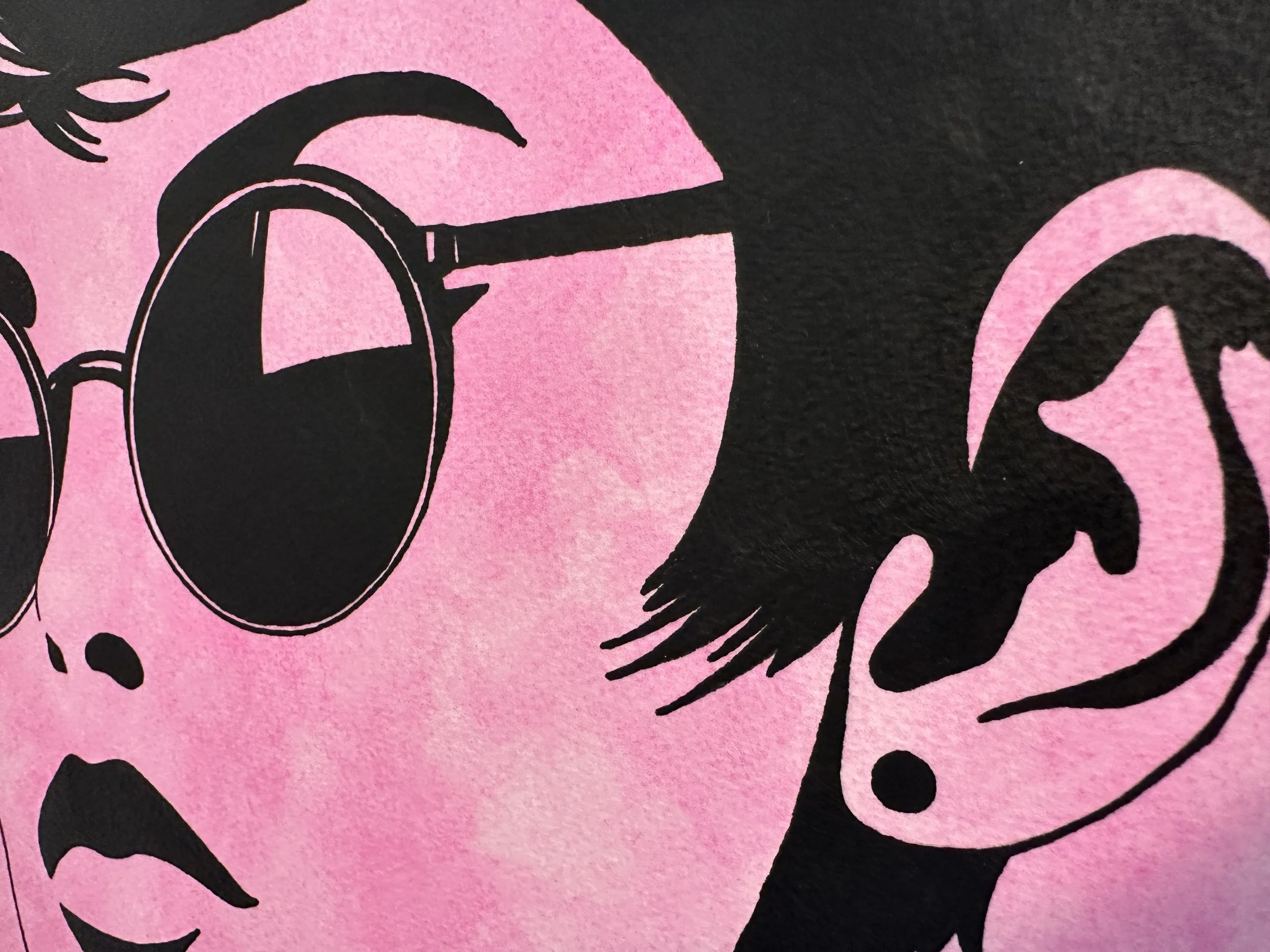 Side view of the textured black frame showing the archival mounting without glass.