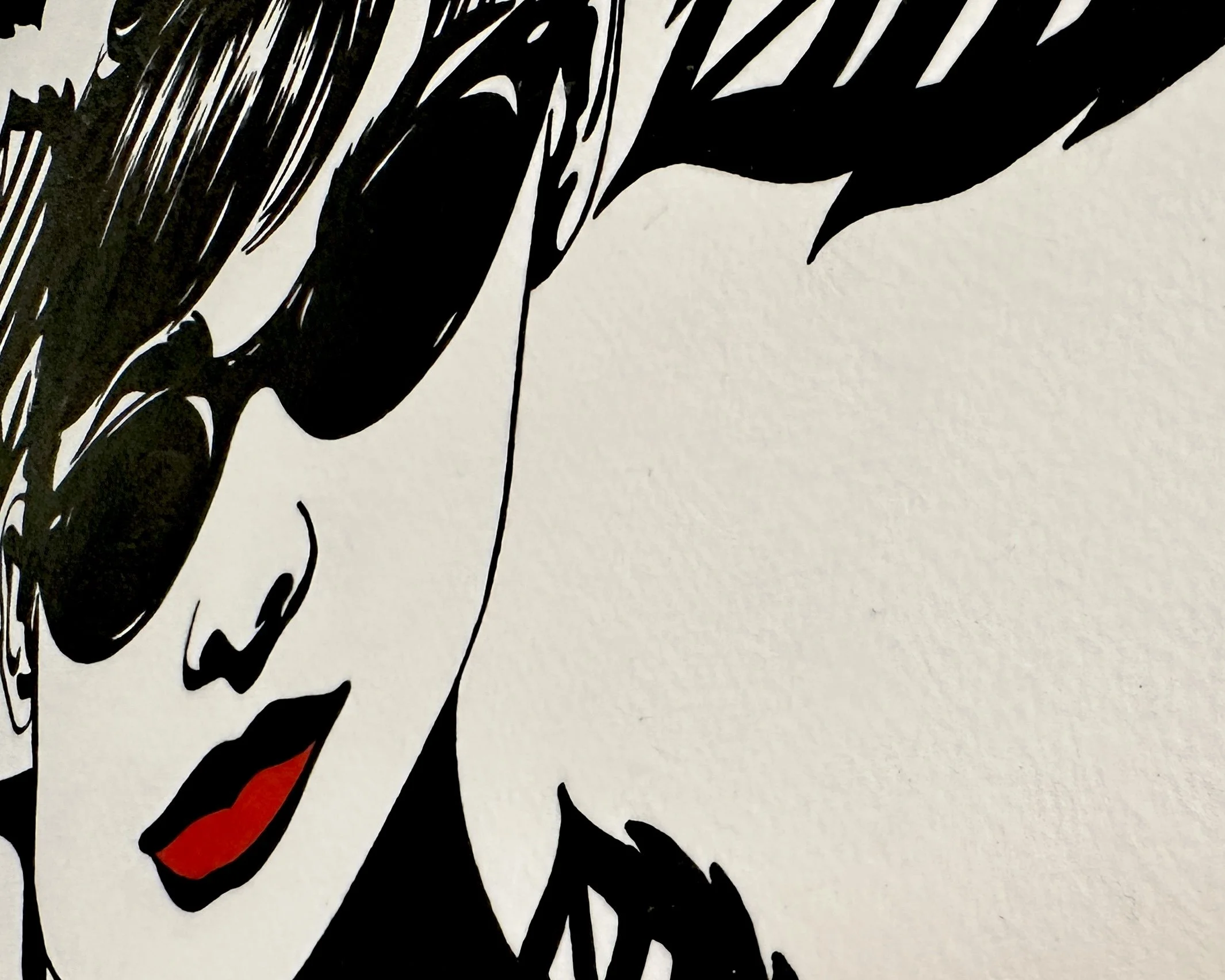 Artist Brett Hodges at Quiet Corner Art Studio, Omaha, NE, original gouache Pop Art portrait inspired by Audrey Hepburn and Breakfast at Tiffany’s with bold black and white linework and red accents.