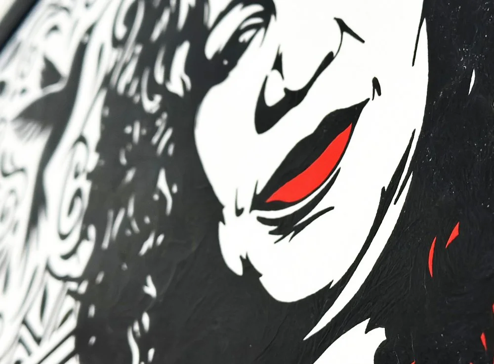 Close up macro detail of black gouache brushwork on the hummingbirds and intricate background pattern.