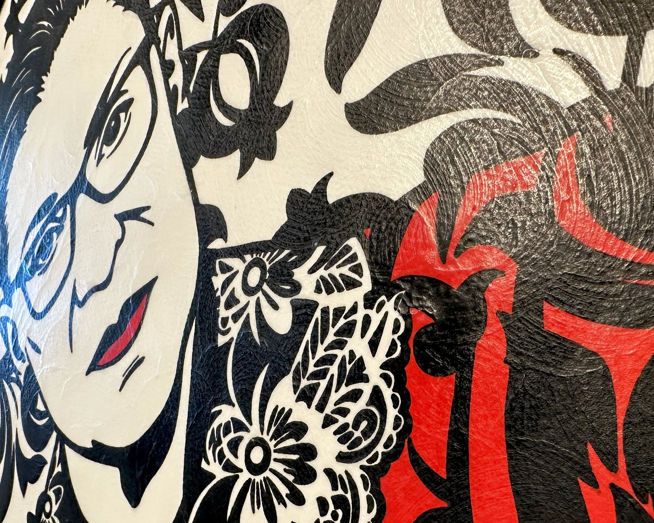 Artist Brett Hodges at Quiet Corner Art Studio, Omaha, NE, original gouache Pop Art portrait of Ruth Bader Ginsburg with bold black and white contrast and red accents.