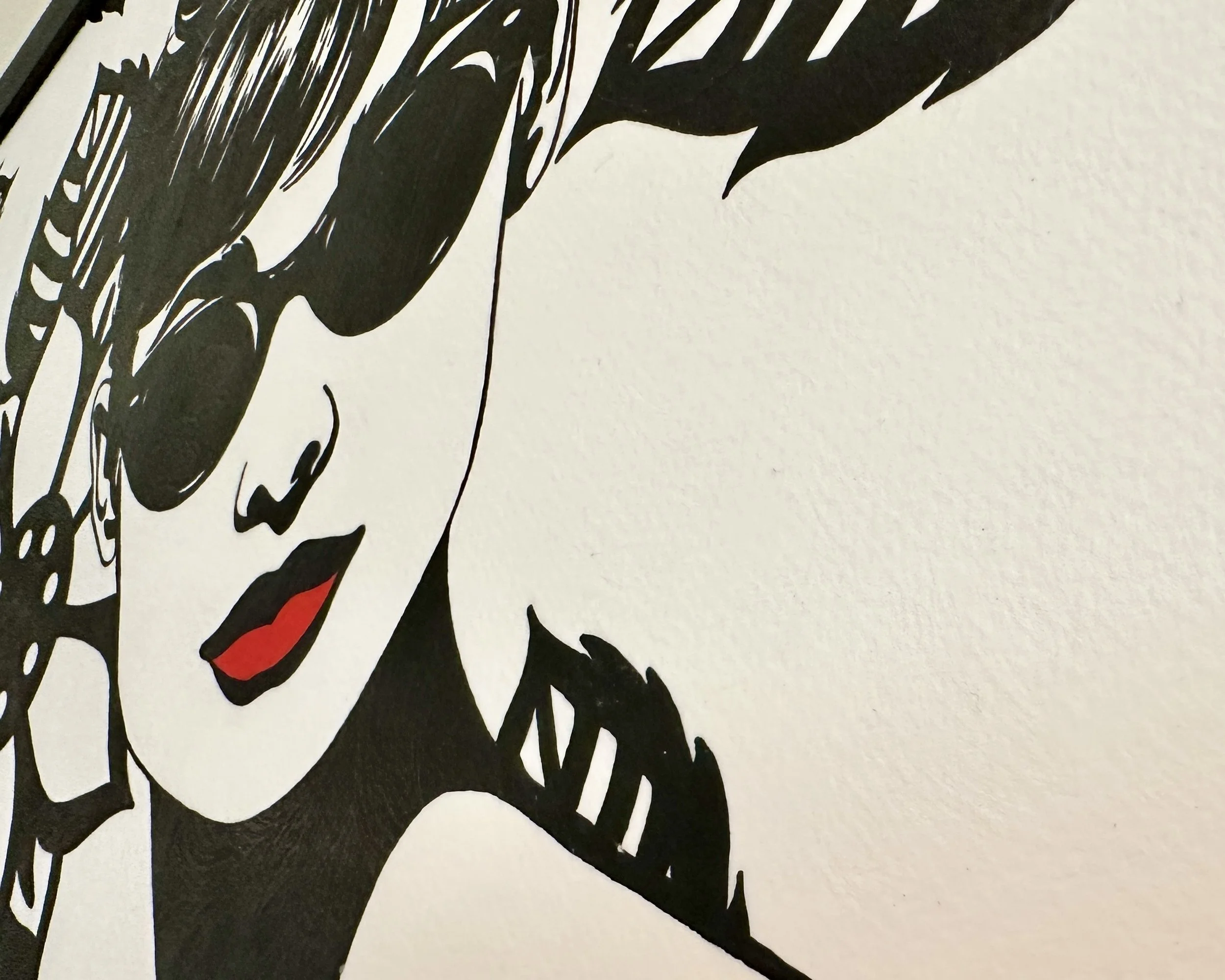 Original framed painting titled In Audrey's Footsteps featuring a pop art portrait of Audrey Hepburn with sunglasses and a floral background by Omaha artist.