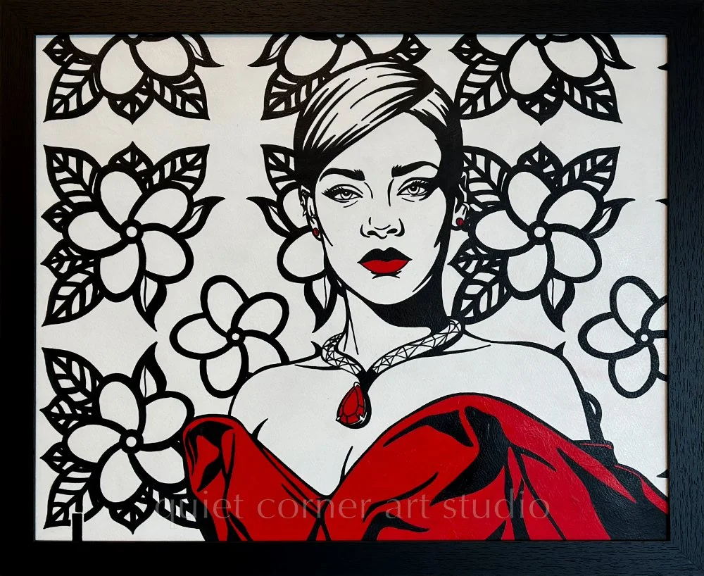 Artist Brett Hodges at Quiet Corner Art Studio, Omaha, NE, Pop Art portrait of Rihanna with bold black and white contrast and contemporary red accents.