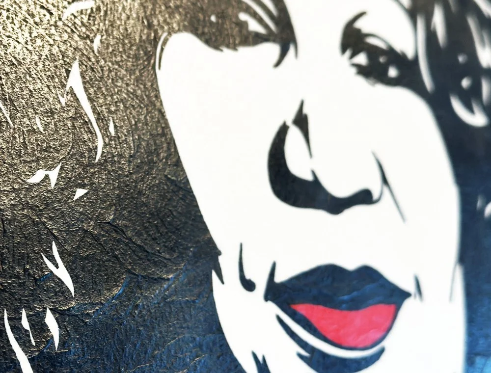 Close up detail of vibrant red lips and graphic black silhouette on archival cotton paper.