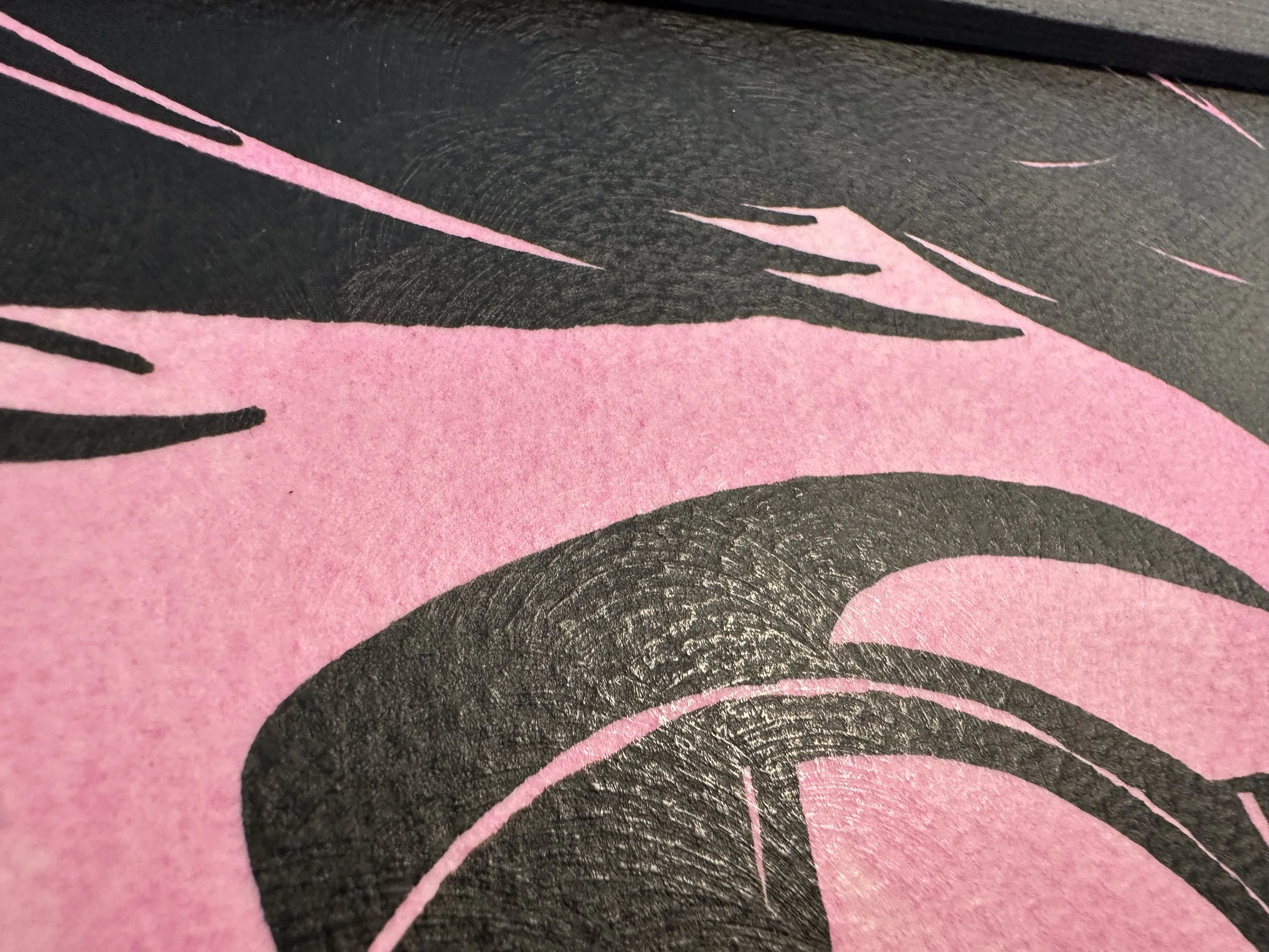 Detail of textured pink gouache background and graphic black silhouette.