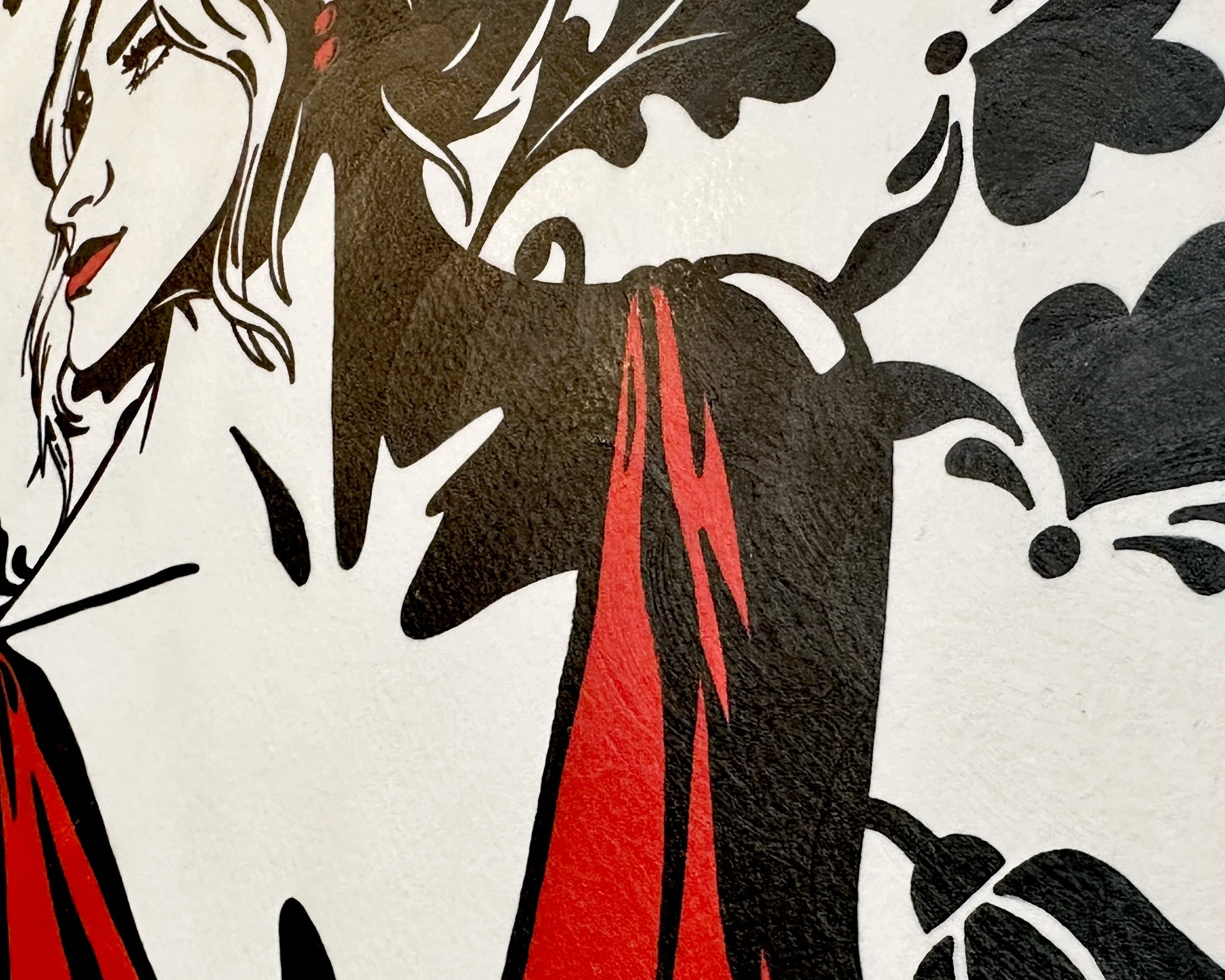 Artist Brett Hodges at Quiet Corner Art Studio, Omaha, NE, detail of the A Promise to Herself portrait showing the red dress, black and white floral background, and bold minimalist Pop Art structure.