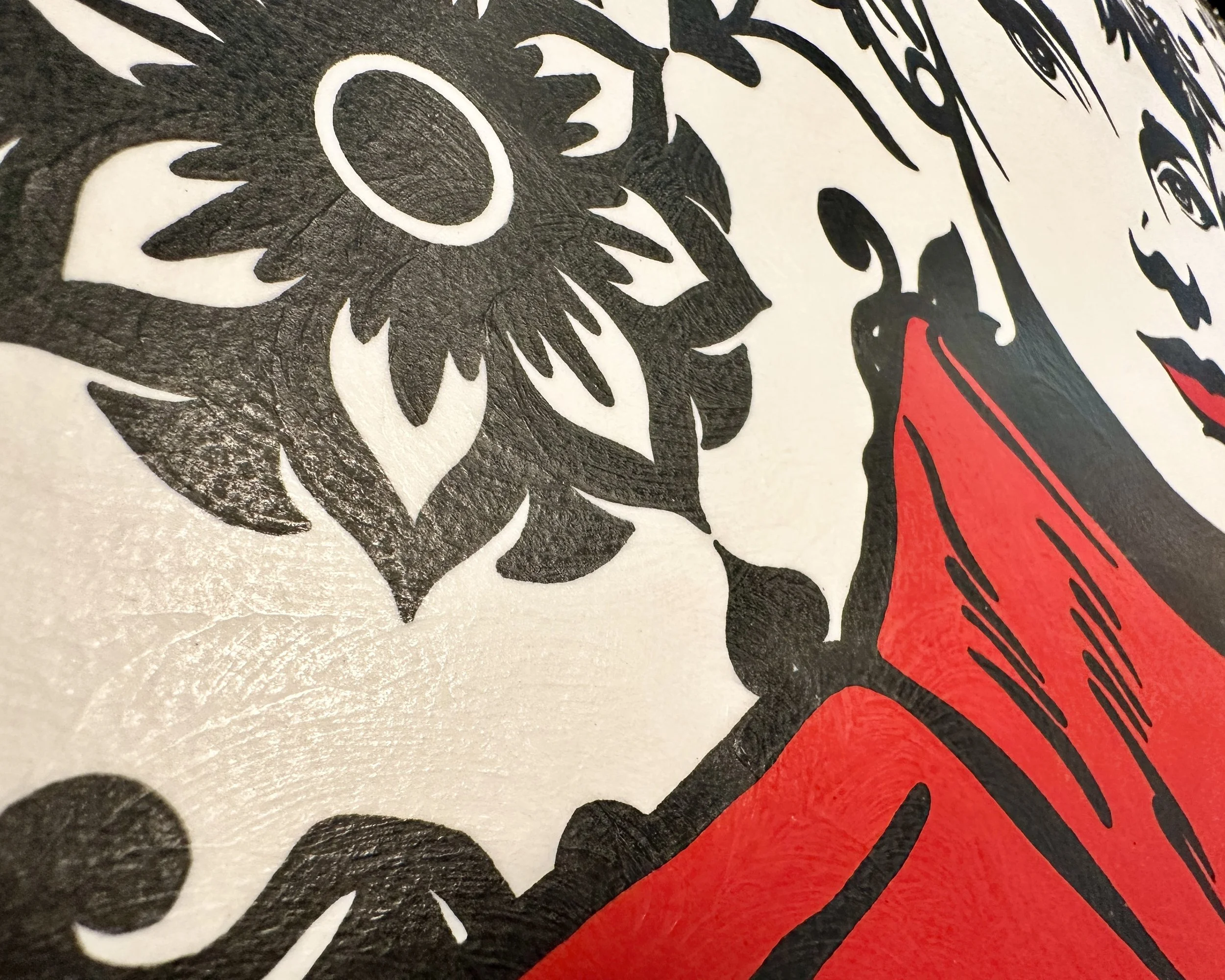 Original framed painting titled Audrey in Red featuring a pop art portrait of Audrey Hepburn in profile with large earrings and a red dress against a geometric pattern by Omaha artist.