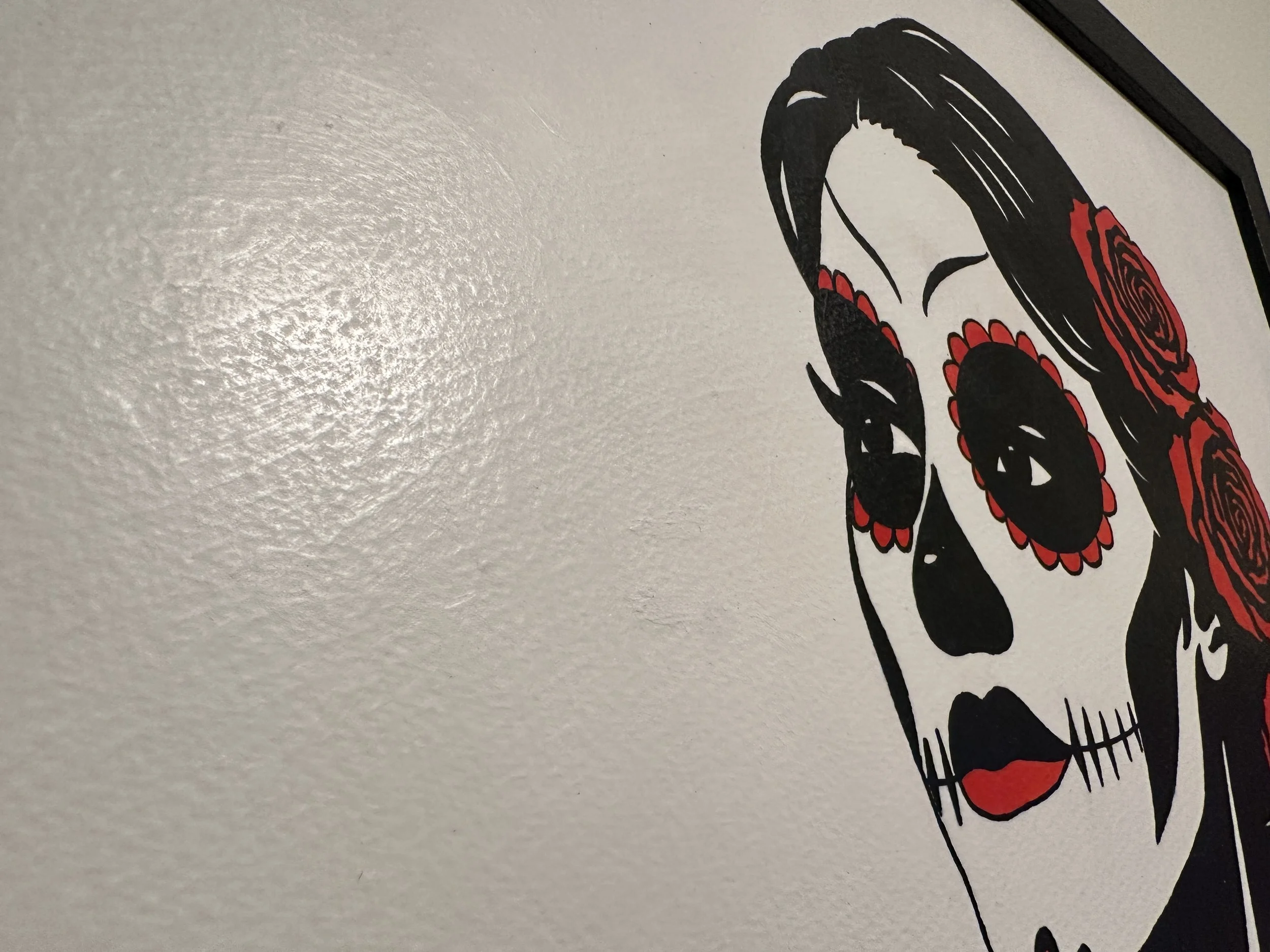 Side view of the textured black frame showing the archival mounting and glass free finish.