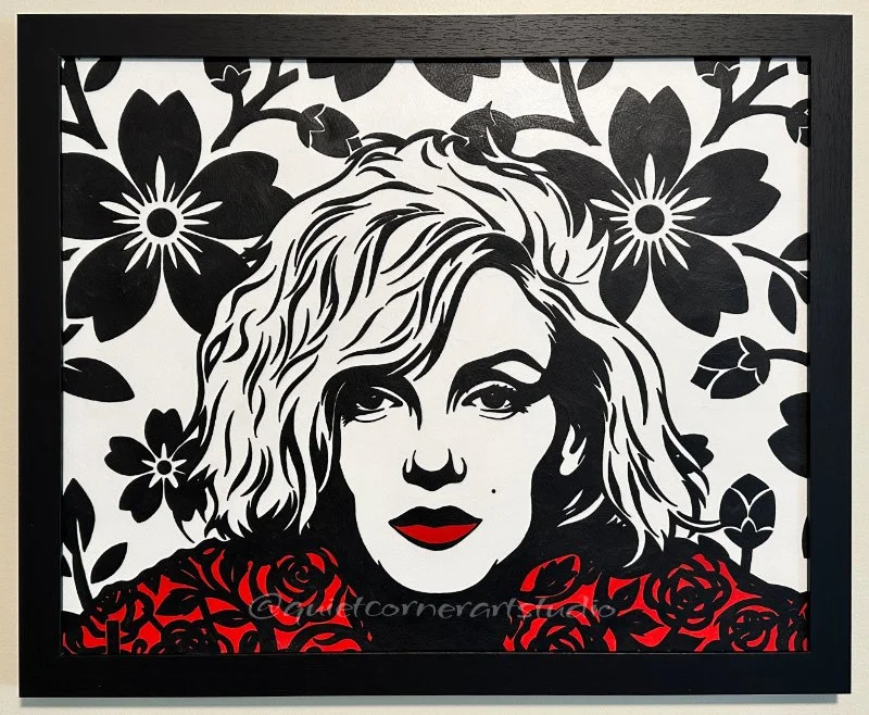 Original framed painting titled Marilyn's Legacy featuring a high contrast pop art portrait of Marilyn Monroe against a complex gold and black geometric pattern by Omaha artist.