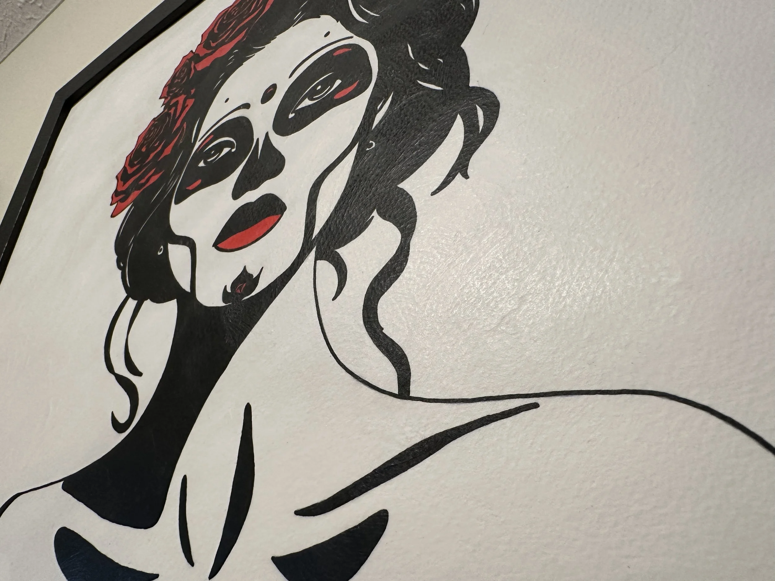 Side view of the textured black frame showing the archival mounting without glass.