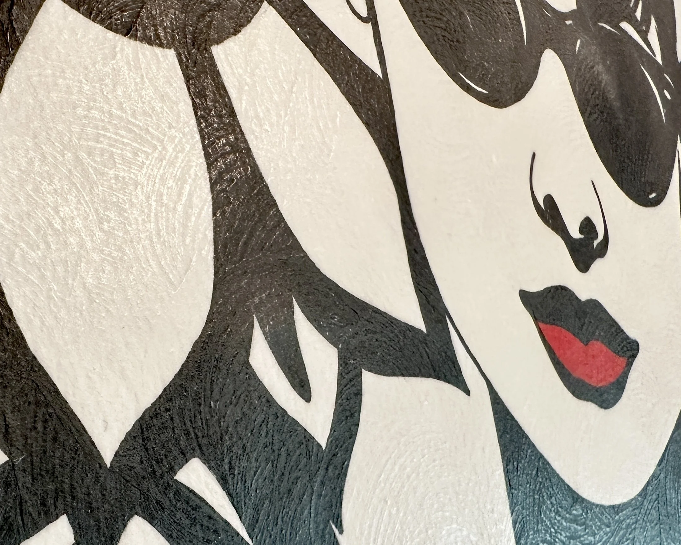 Artist Brett Hodges at Quiet Corner Art Studio, Omaha, NE, original gouache Pop Art portrait inspired by Audrey Hepburn and Breakfast at Tiffany’s with bold black and white linework and red accents.