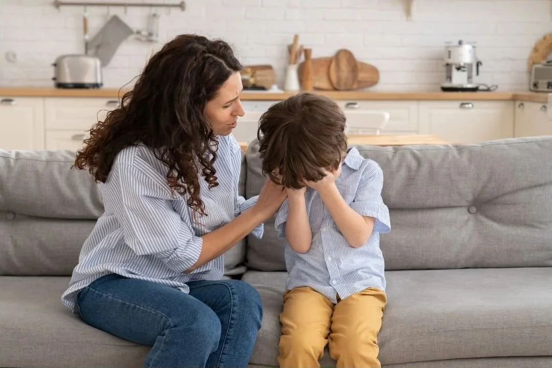 mom comforting upset child