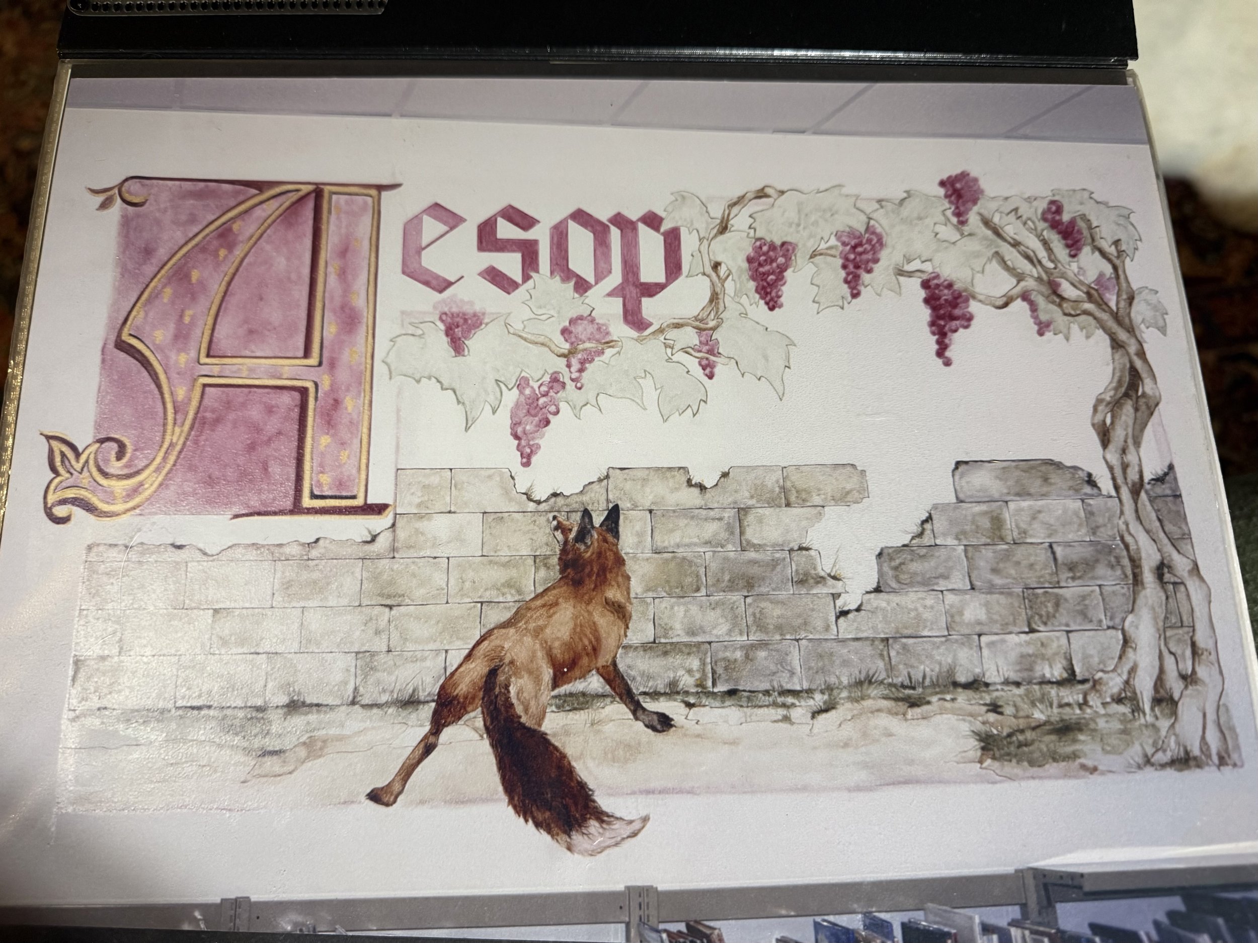 A painting depicts a dog walking down a brick wall, with a large vine with grapes and leaves extending across the top part.