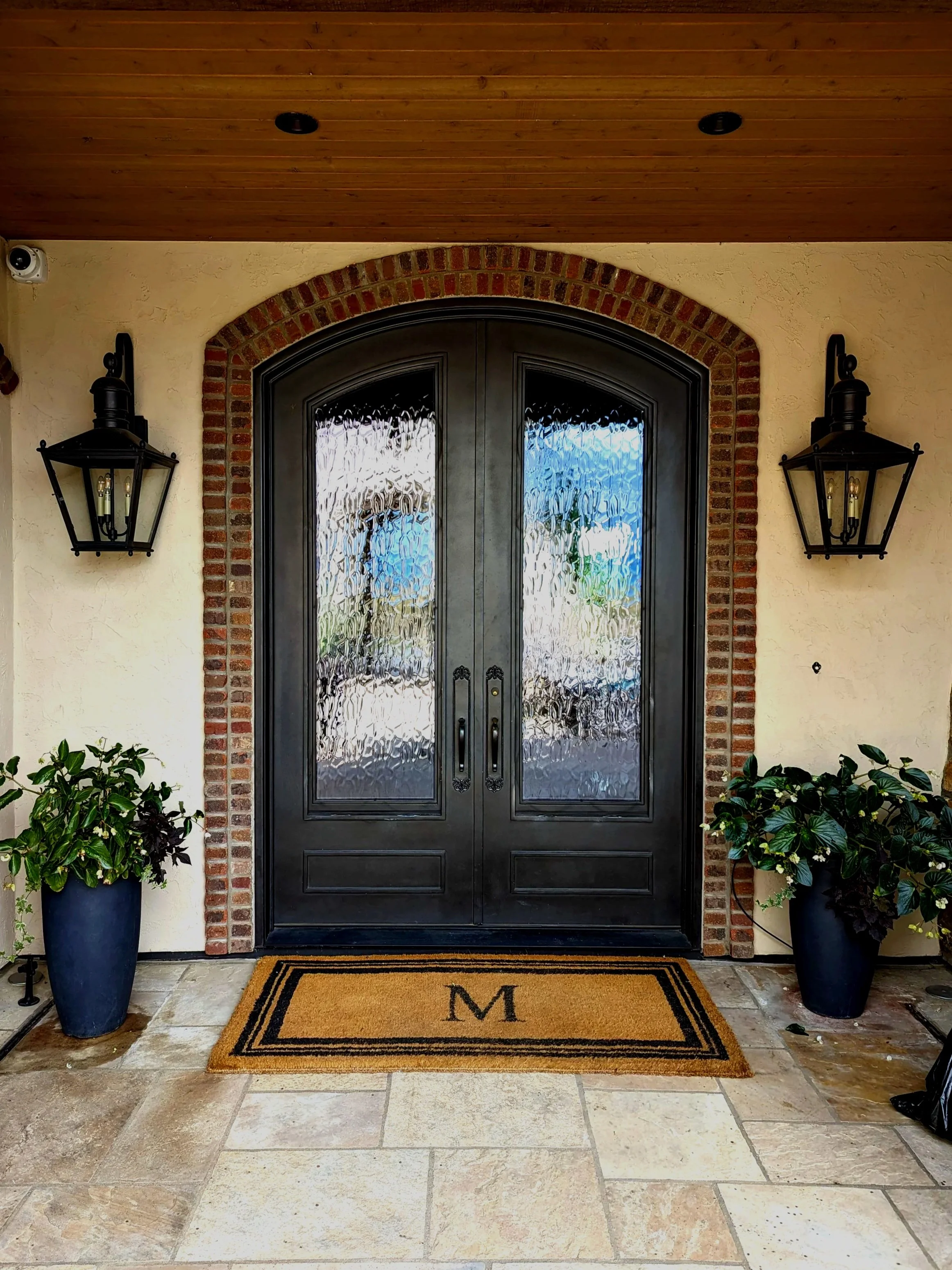 Custom welded and fabricated metal door in entry way.