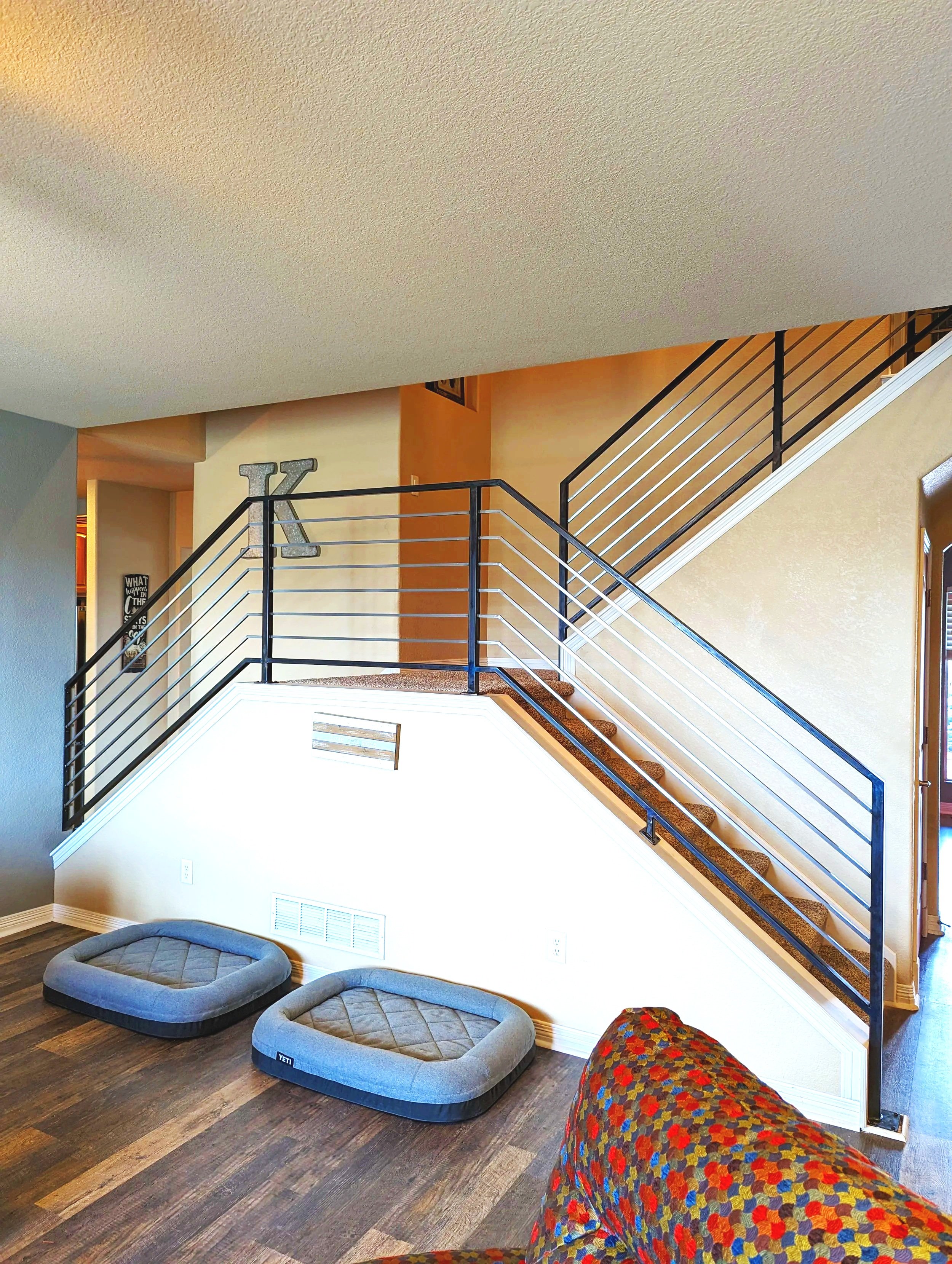 After of the home railing the railing now horizontal pickets and metal