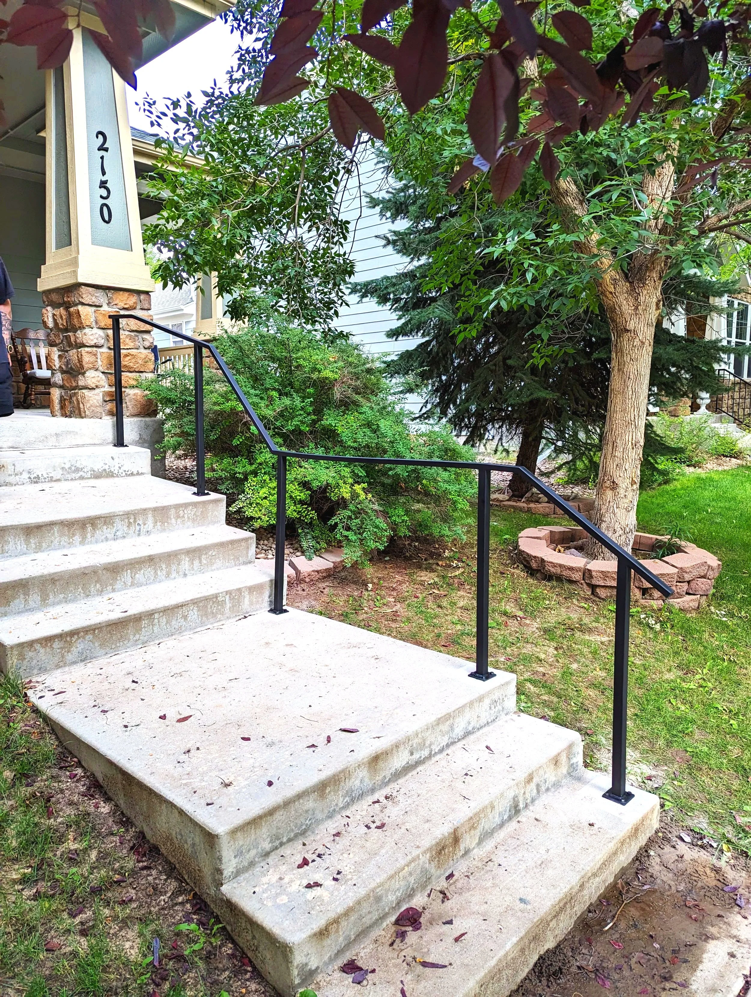 Exterior Handrail from front porch to driveway at a suburban home