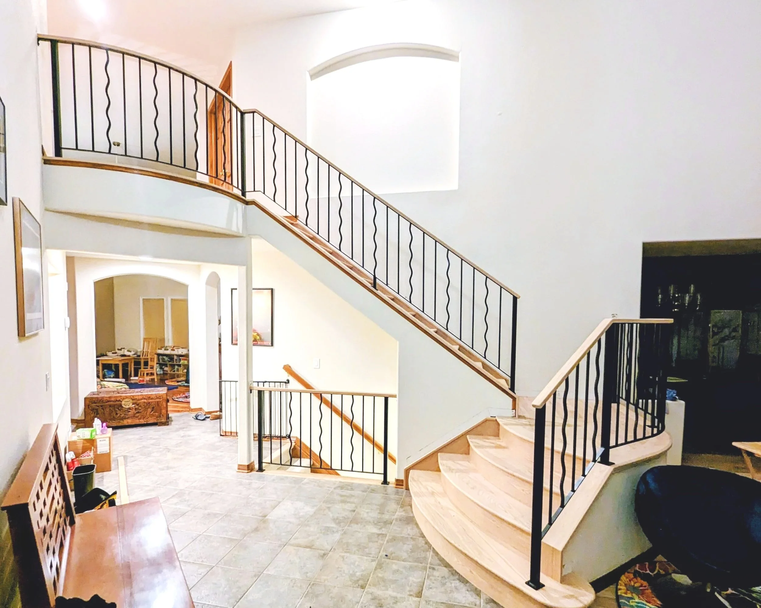 Custom metal stair railing fabricated and installed for an interior staircase  Placement