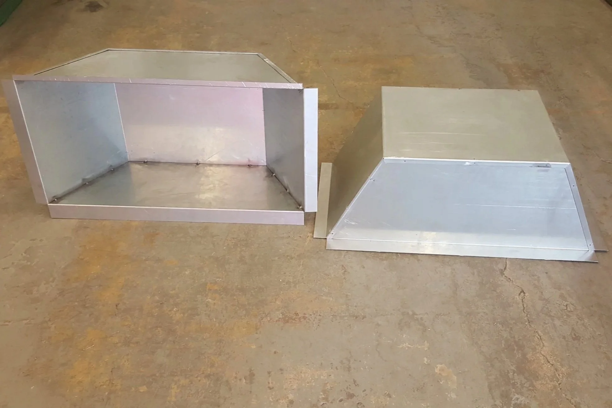 Custom fabricated sheet aluminum metal wheel covers formed and assembled in metal shop.