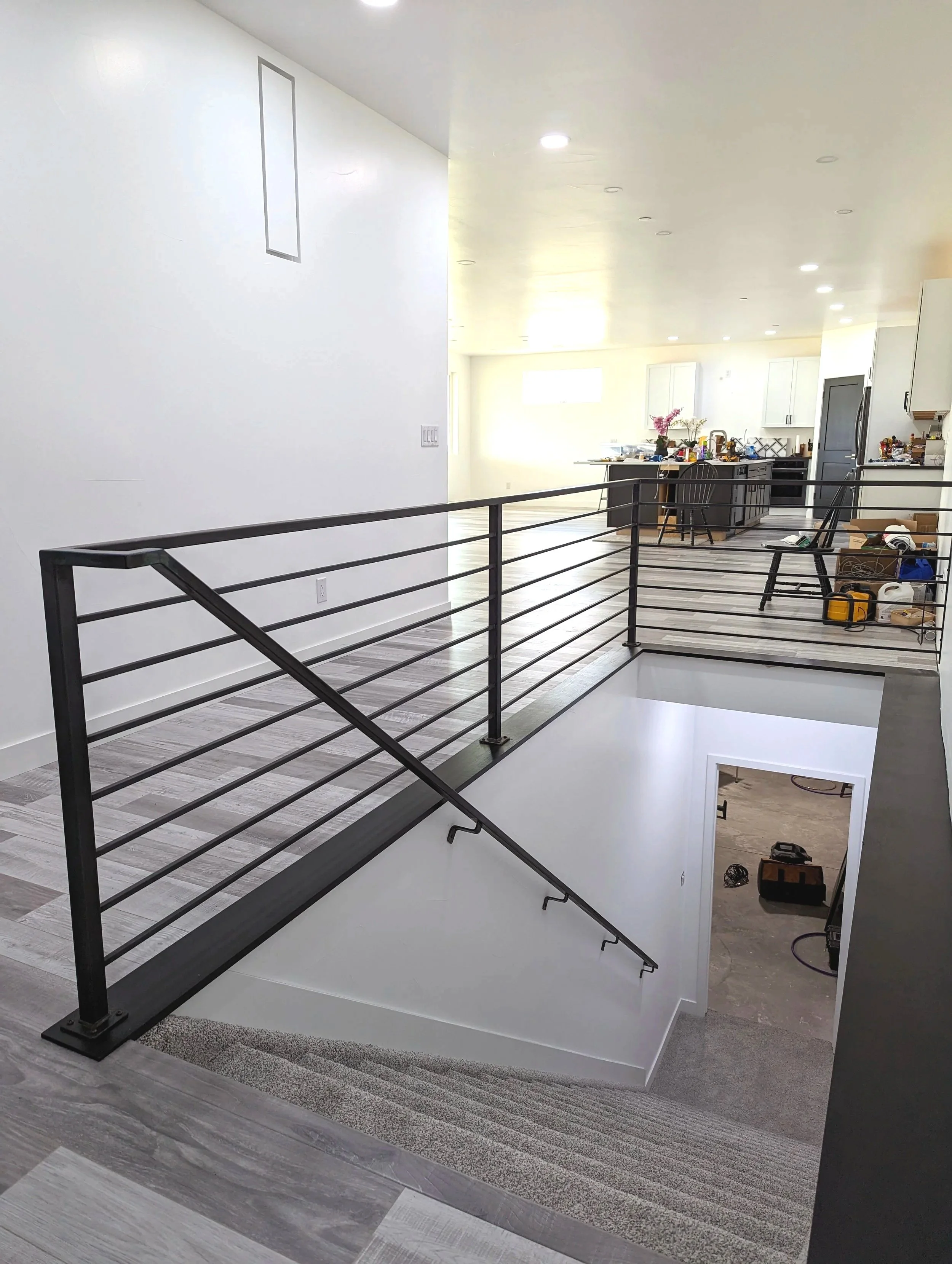 Interior metal railing with a handrail in a modern home