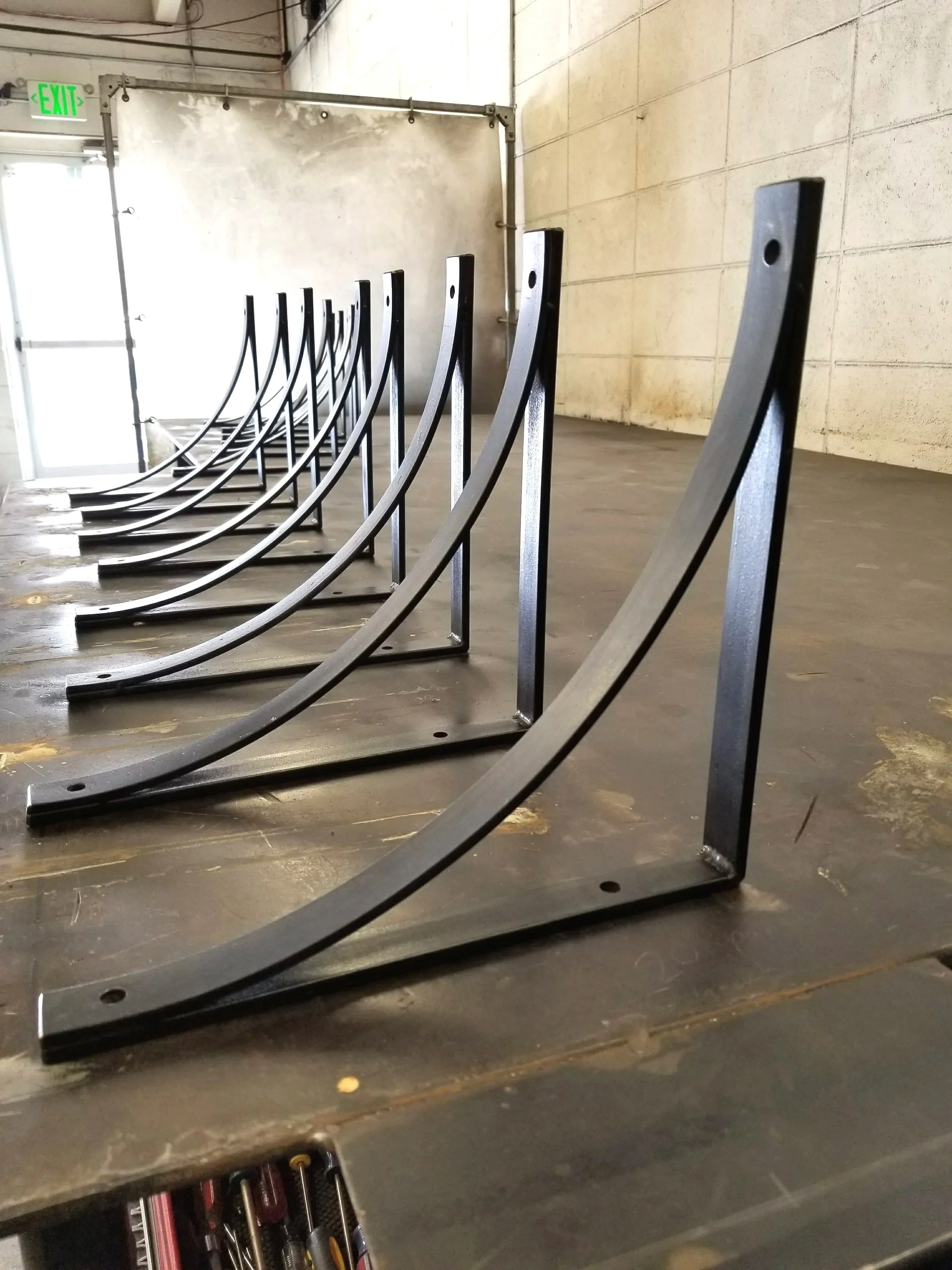 Custom metal brackets fabricated in shop for project-specific applications