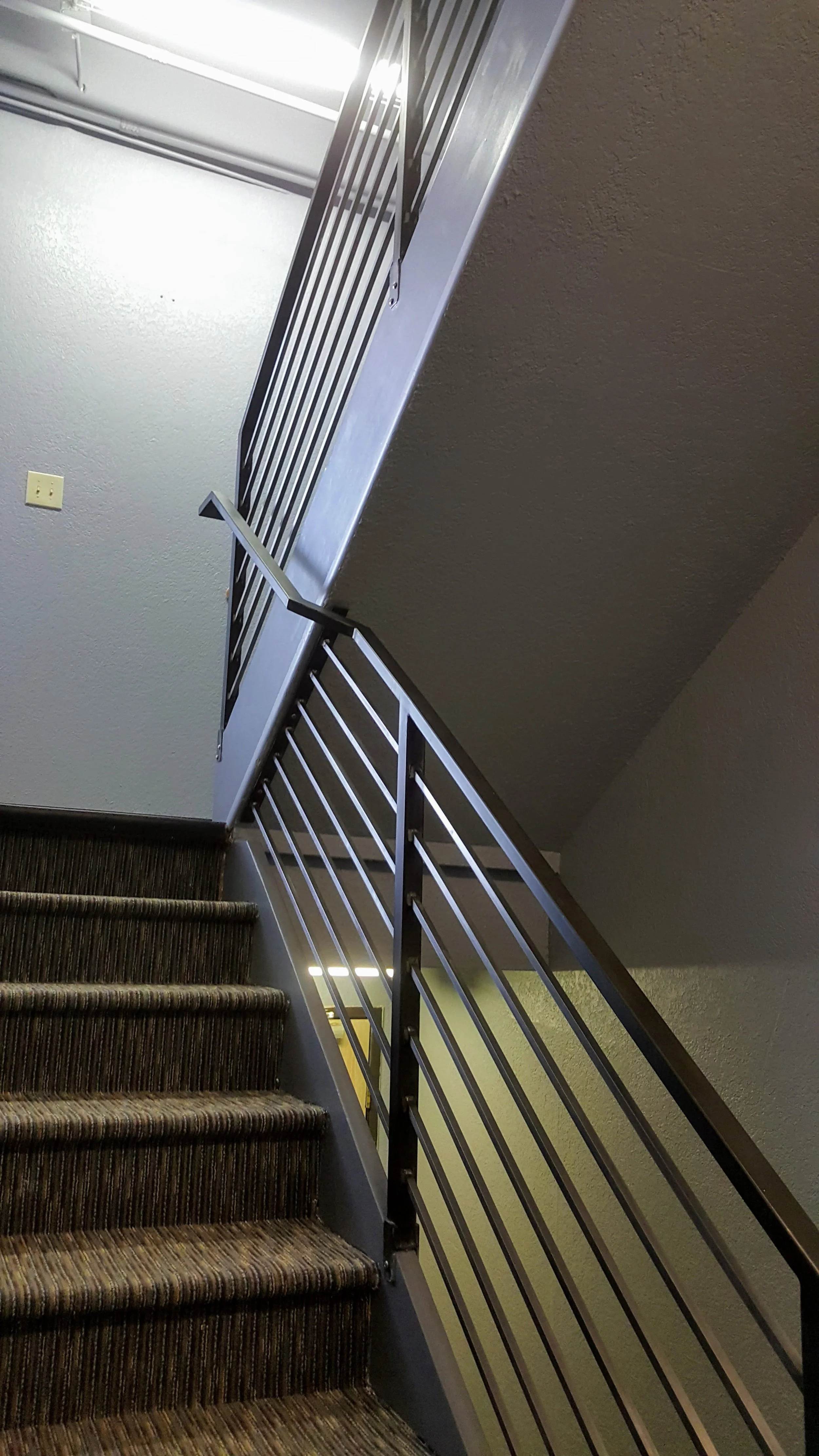 interior iron railing commercial space multiple levels