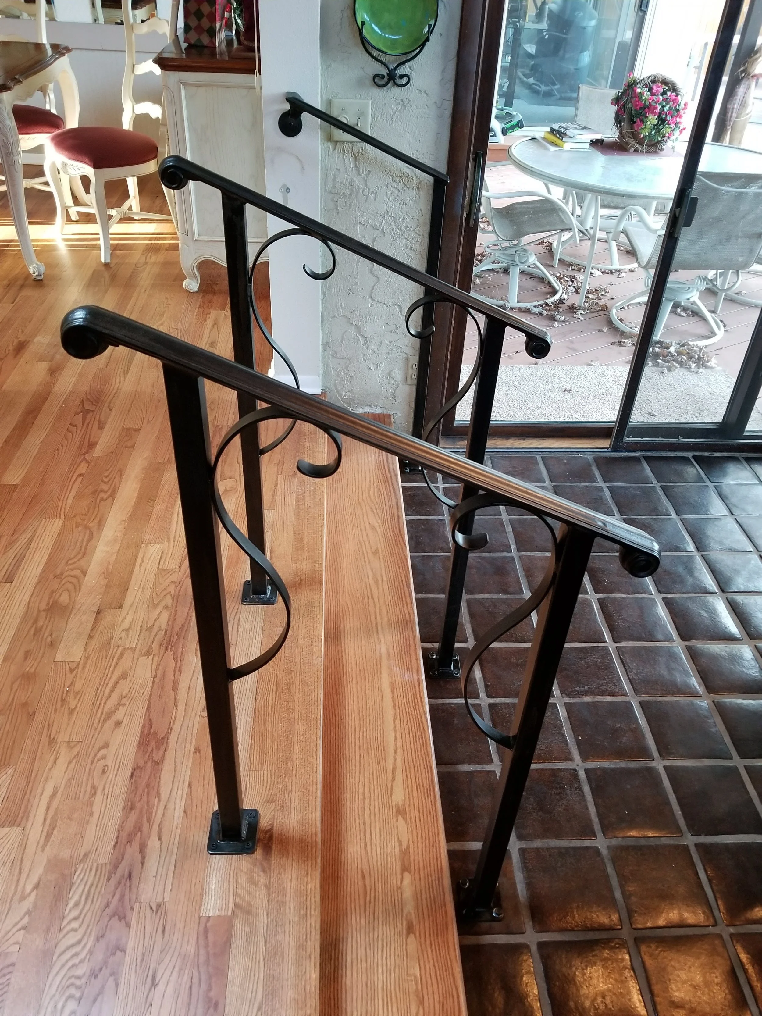 Hand railing in a home with artistic scrolls
