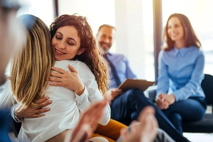 Therapy clients connecting during a session.