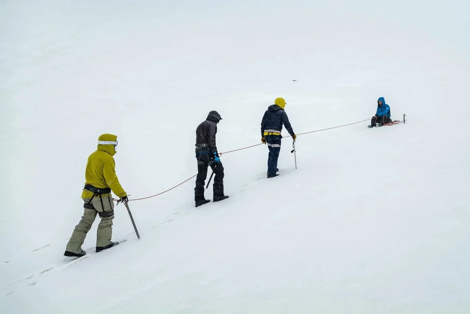 Professional mountain guides leading a backcountry tour on Mount Shasta