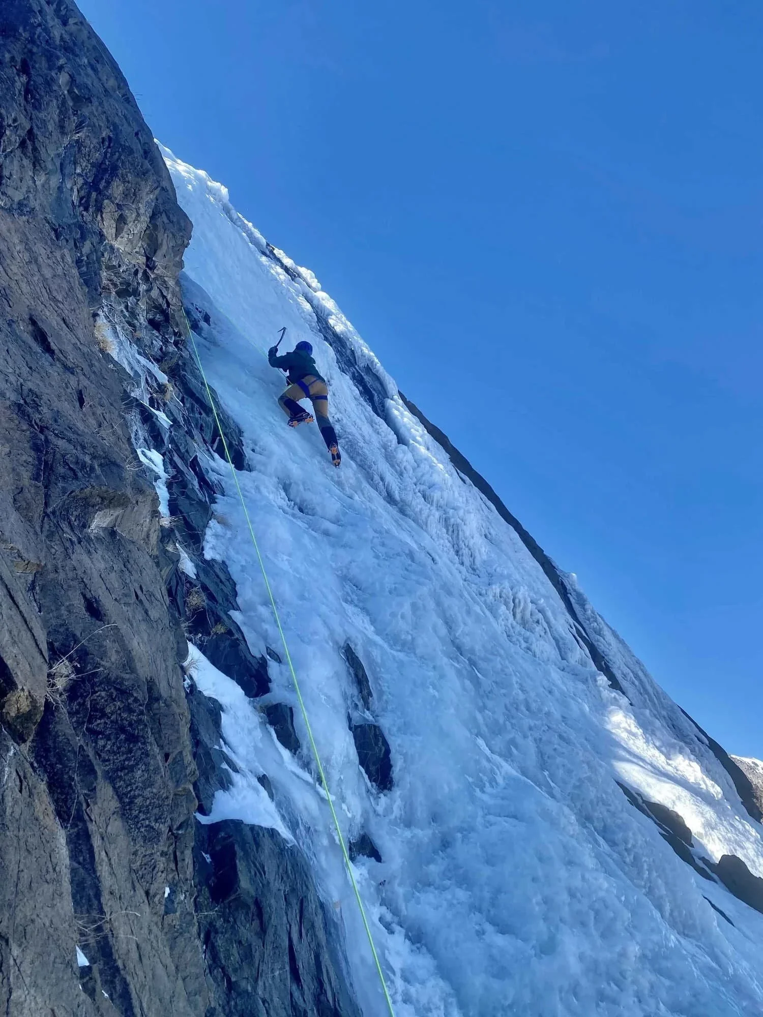 Small group ice climbing course in a winter mountain setting