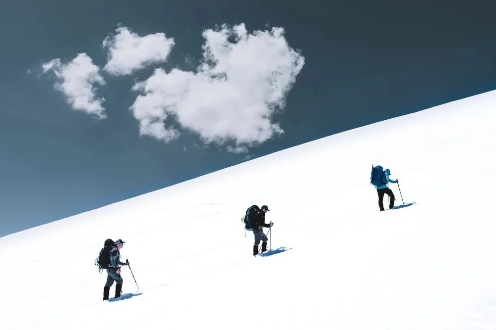 Professional mountaineering guides leading a summit climb on Mount Shasta