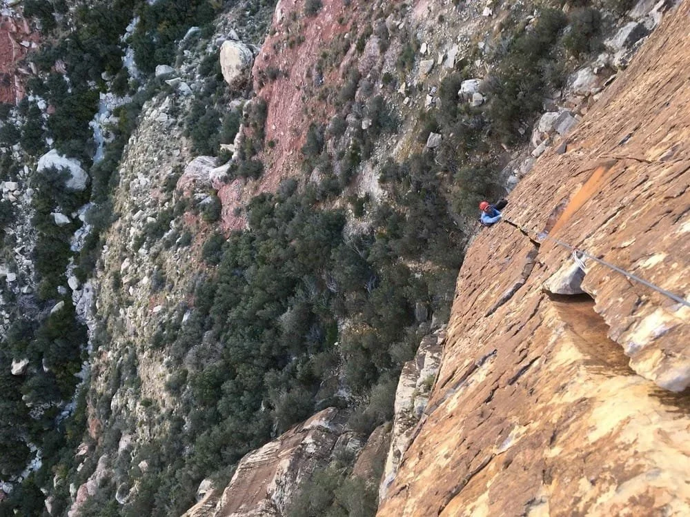 Beginner multi-pitch rock climbing instruction in an outdoor setting