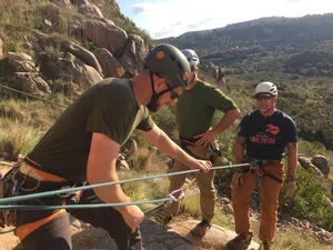 Small group rock climbing self rescue class in a California climbing area
