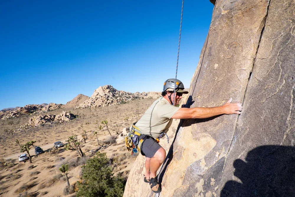 Guided outdoor rock climbing course teaching fundamentals for first-time climbers