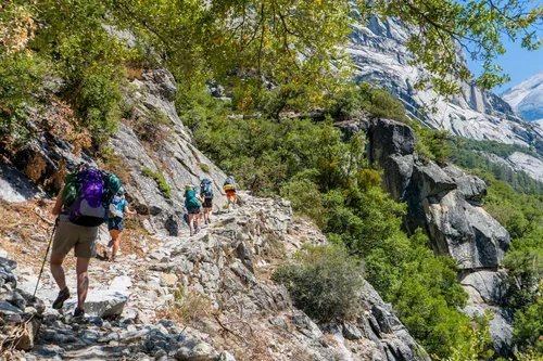 Professional backpacking guides leading a backcountry trip in Yosemite