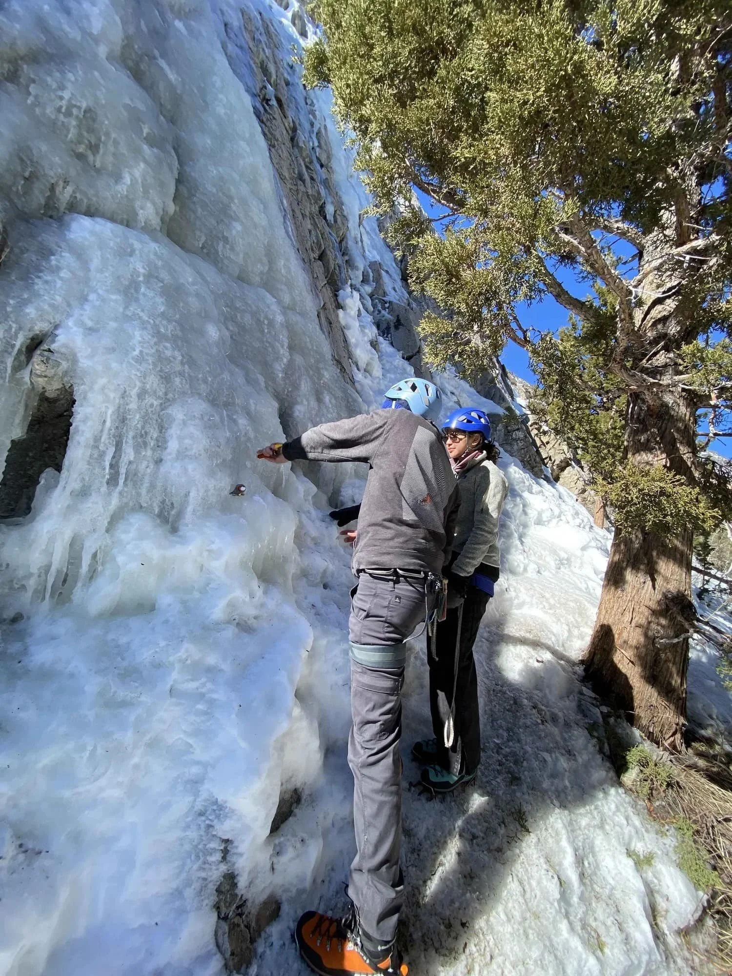 Outdoor ice climbing lesson in a mountain environment