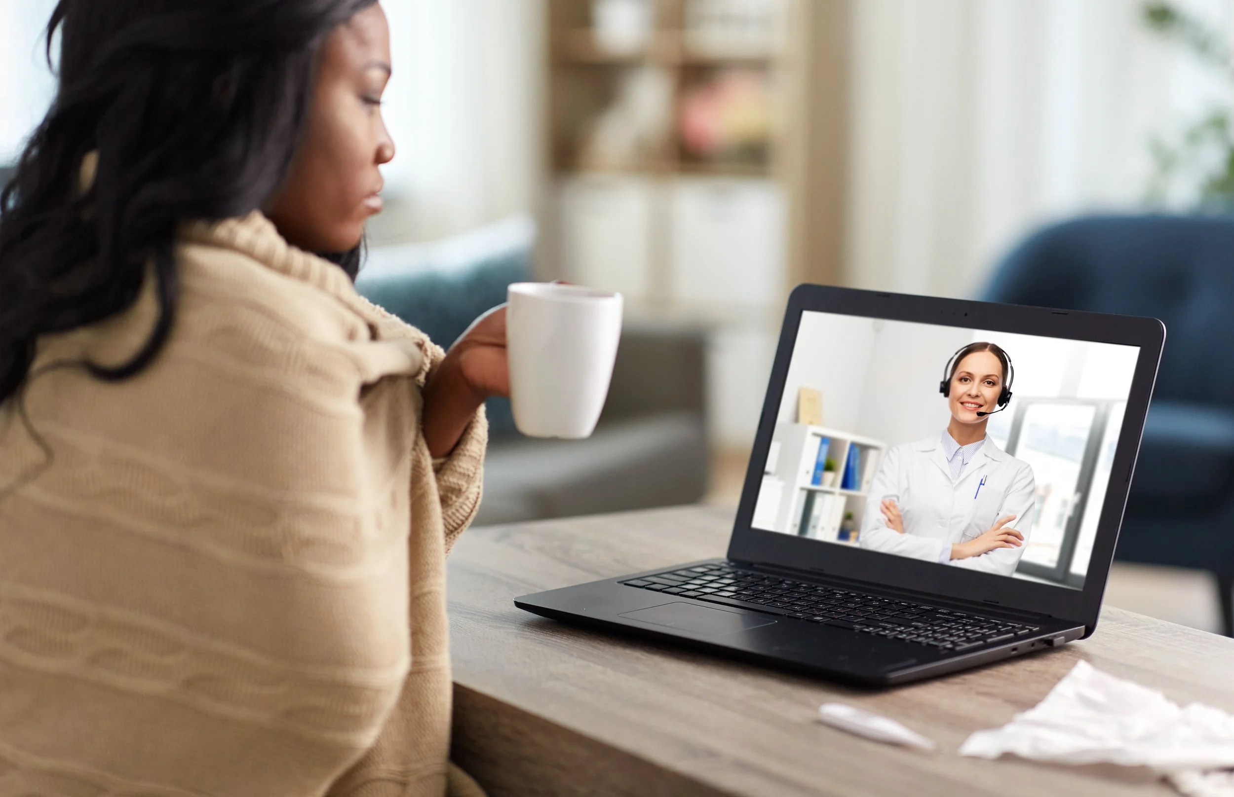 sick-woman-having-video-call-with-doctor-laptop.jpg