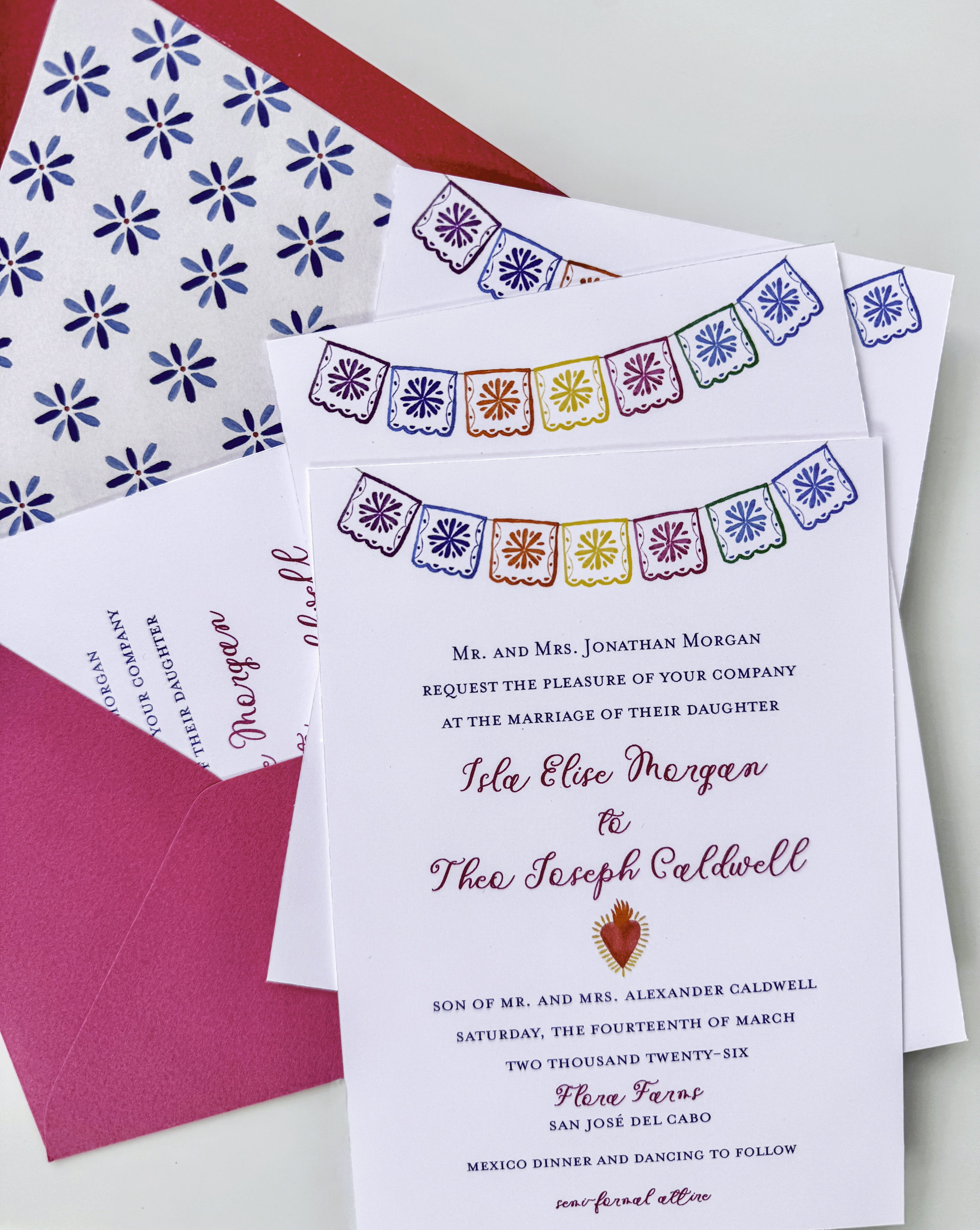 Colorful destination wedding invitation suite featuring tropical flowers, papel picado details, and a hand-painted Flora Farms Cabo Mexico venue illustration.