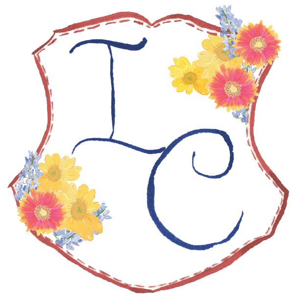 Whimsical Watercolor wedding monogram surrounded by wildflowers for a Texas Hill Country wedding